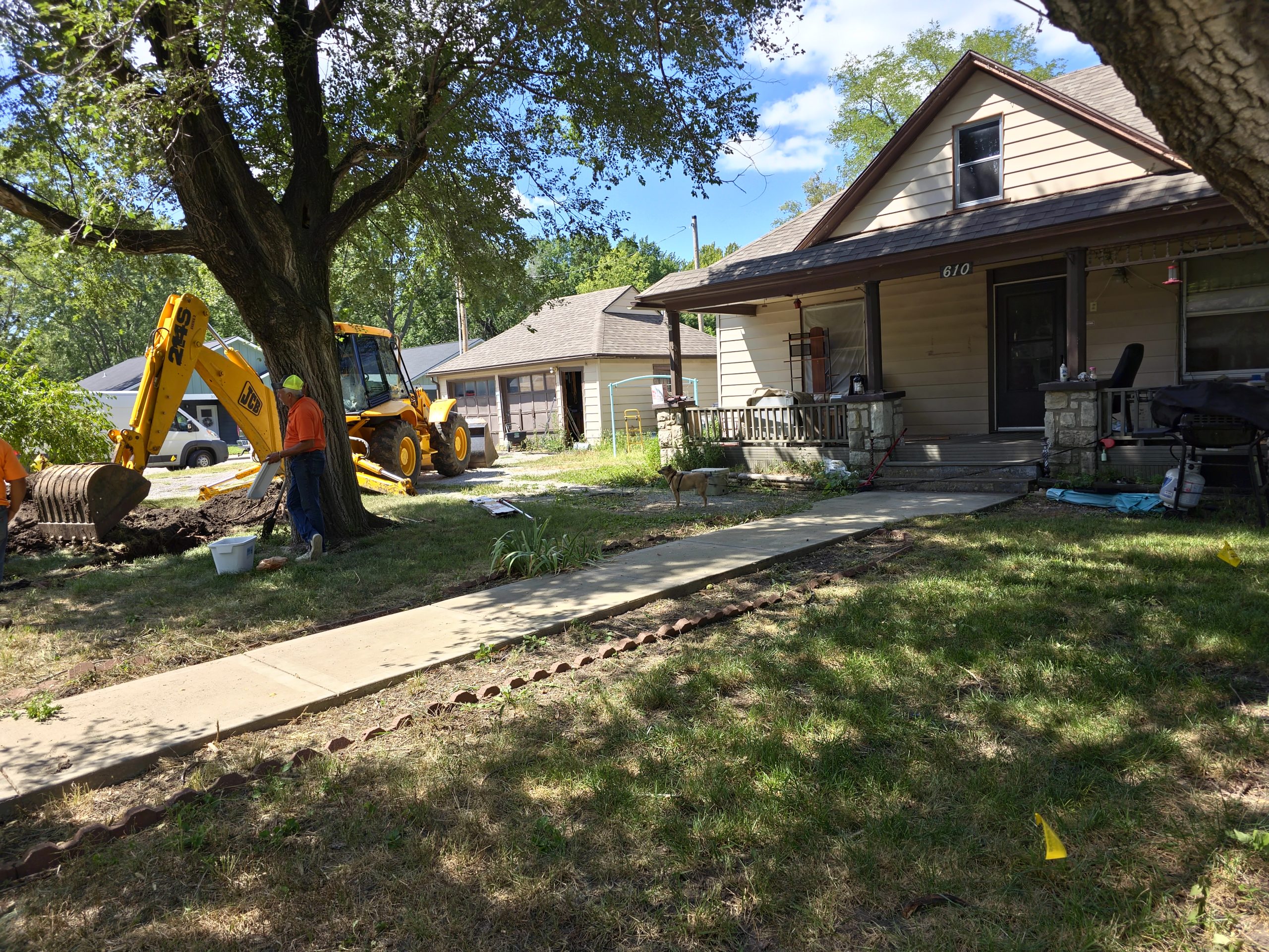 Water sewer pipe excavation with track steer