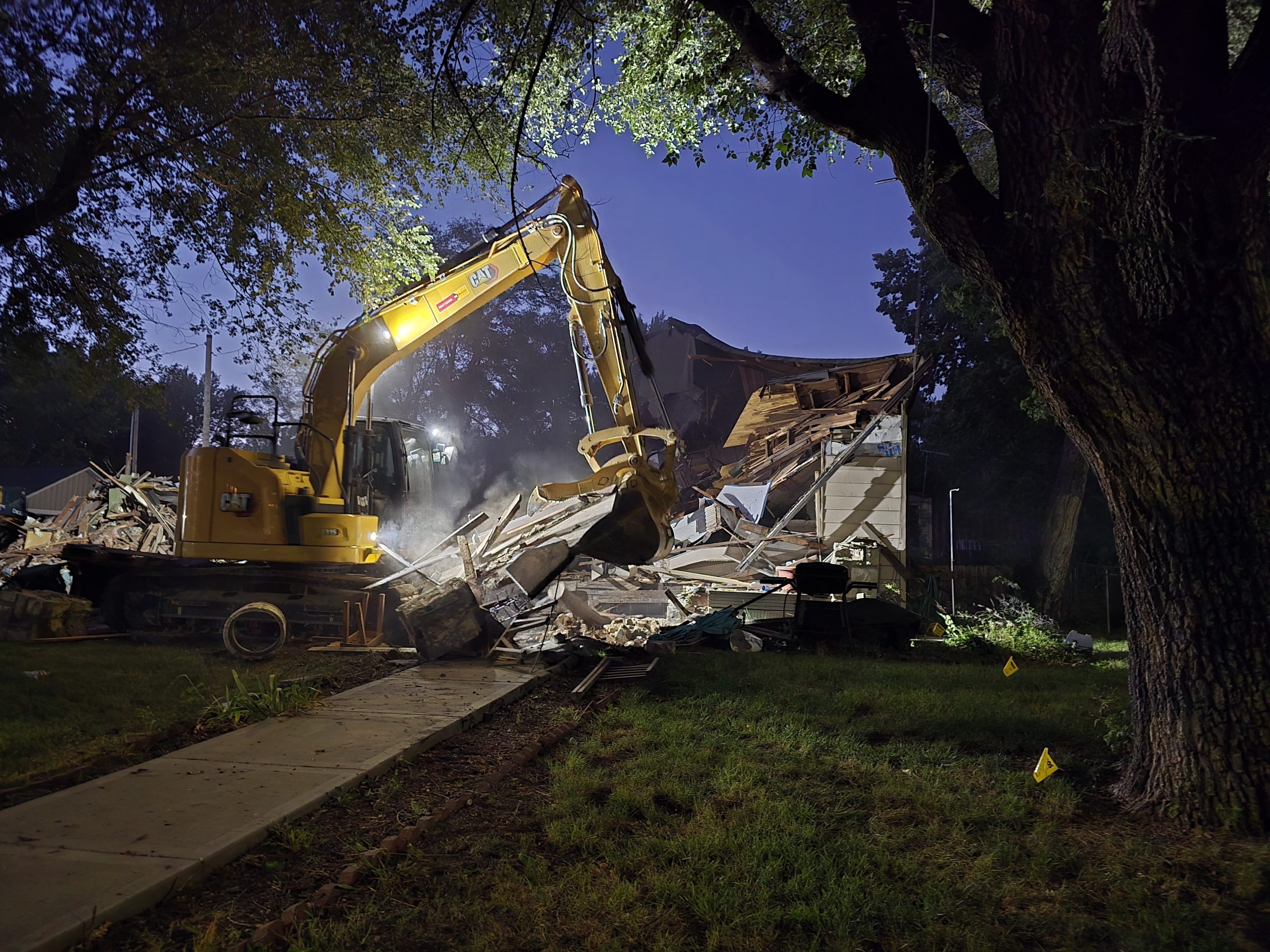 Water sewer pipe excavation with track steer